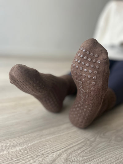 TPD Store Grippy Stocks on feet showing the grips on the sole of Mocha Brown highrise sock