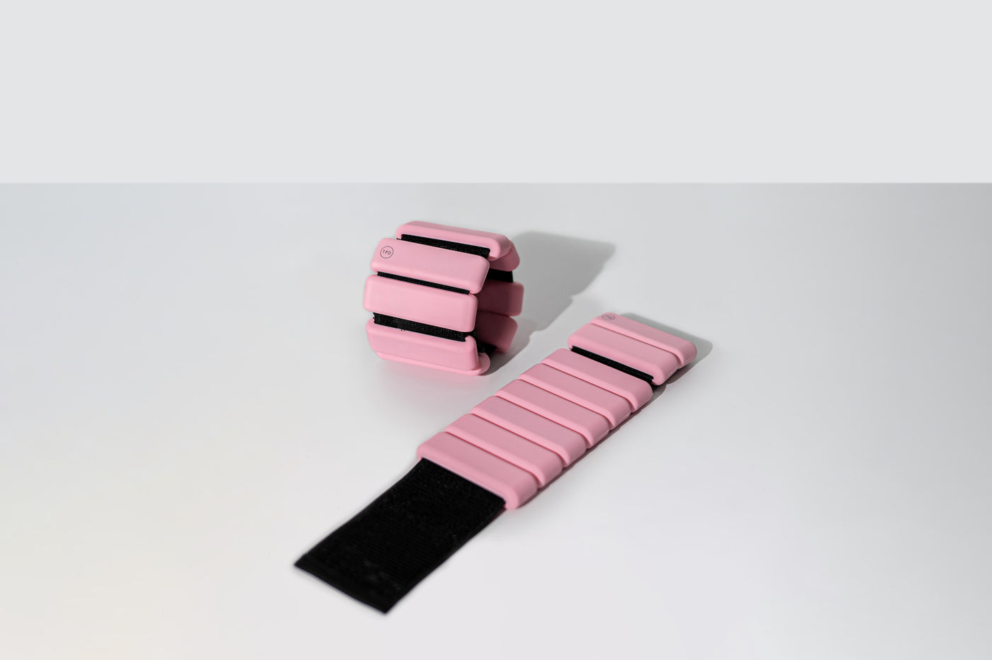pair of tpd store ankle weights one opend and other in ring