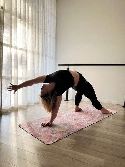woman in back strech on aurora art you are my sunshine tpd store eco friendly yoga mat