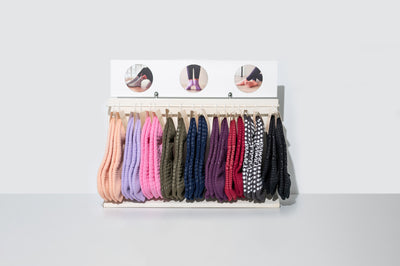 TPD Store Grippy sock display rack with 18 pairs of socks in varying colours