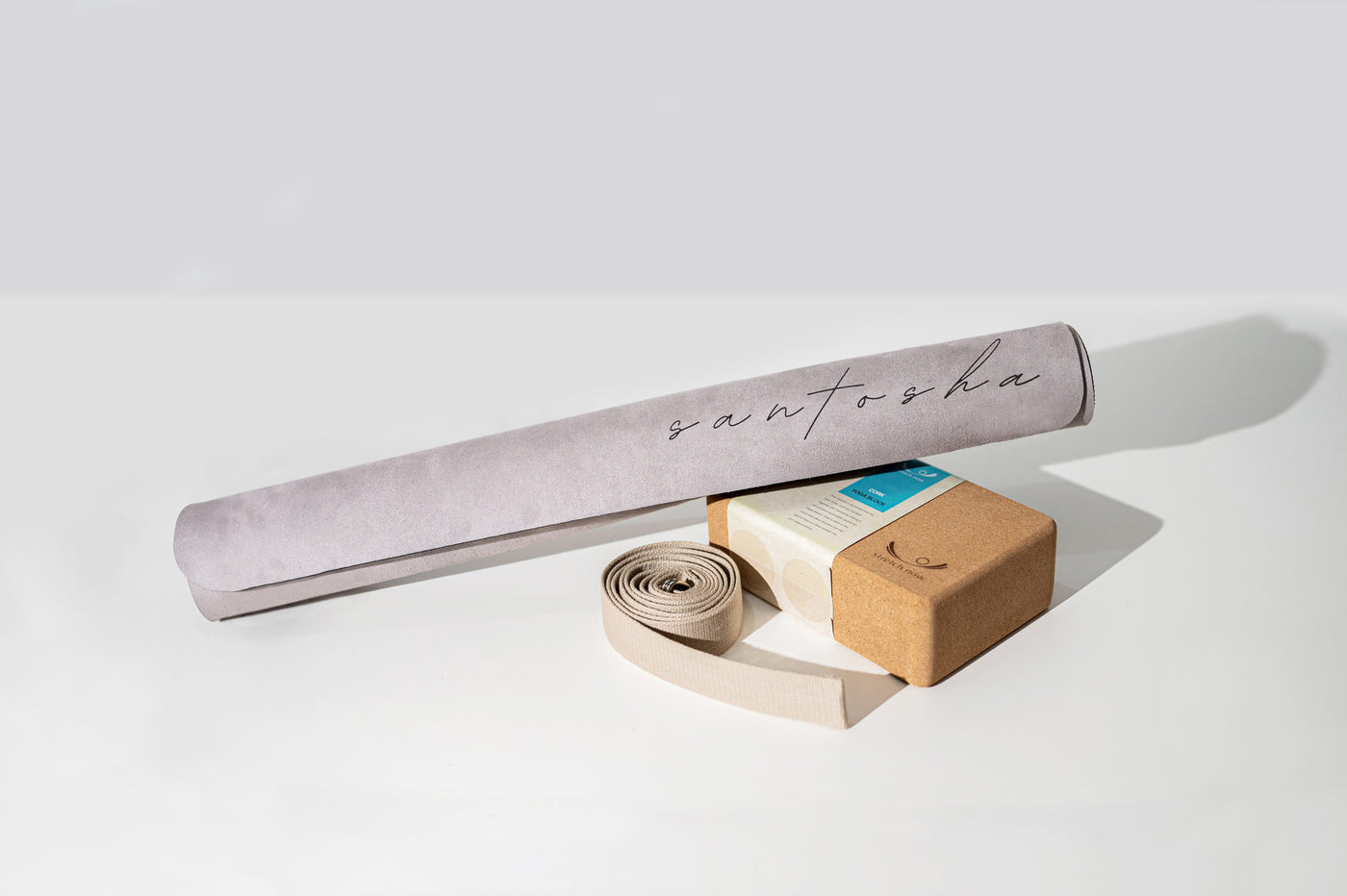 tpd store bundle of yoga mat, cork block and organic cotton strap on a white background