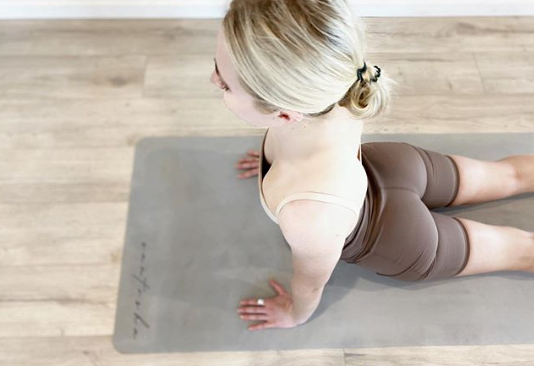 woman in cobra pose on a stone colour tpd store eco friendly yoga mat