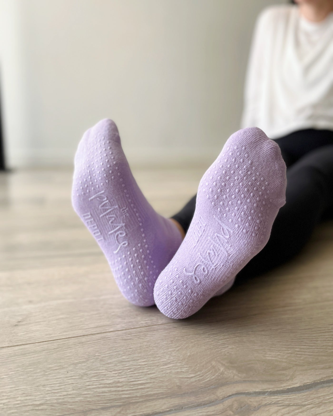 flexed feet in a pair of french lilac low rise tpd store grippy socks